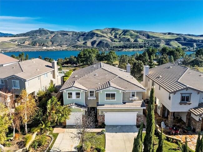 Aerial view of homes overlooking Castaic Lake and the hills in Castaic, California